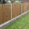 Closeboard panels with concrete posts and gravel boards