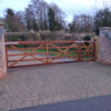 Kennett gate unequal pair with solid base rail in oiled Iroko