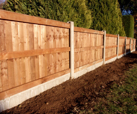 Back of Closeboard panels with concrete posts and gravel boards