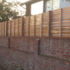 Horizontal wall top fencing in cedar