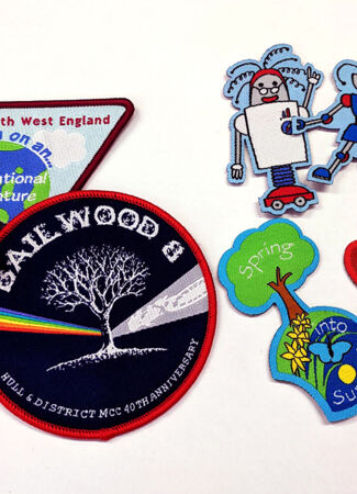 Woven Badges with overlocked or heat cut borders