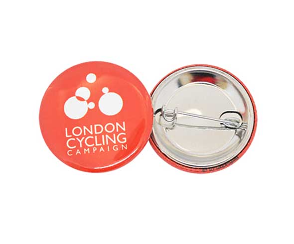 Colourful button badges with safety pin