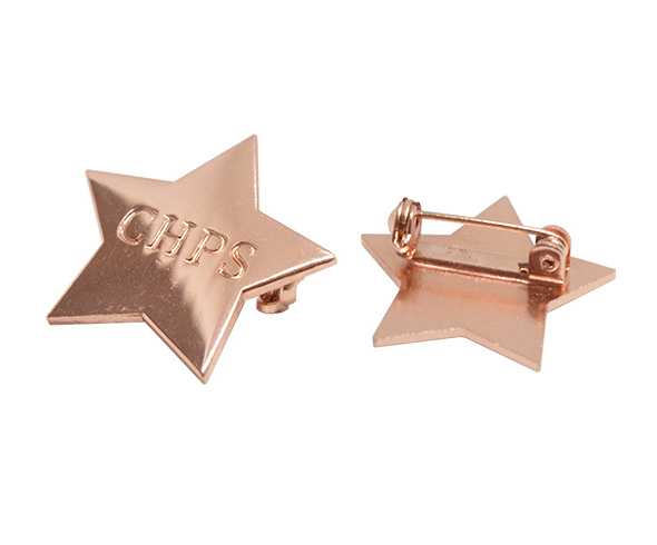 Stamped metal badge with copper plating