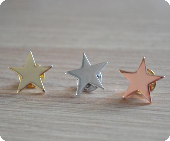 Gold, silver and bronze star badges