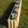 Log extender shown here filled with flowers