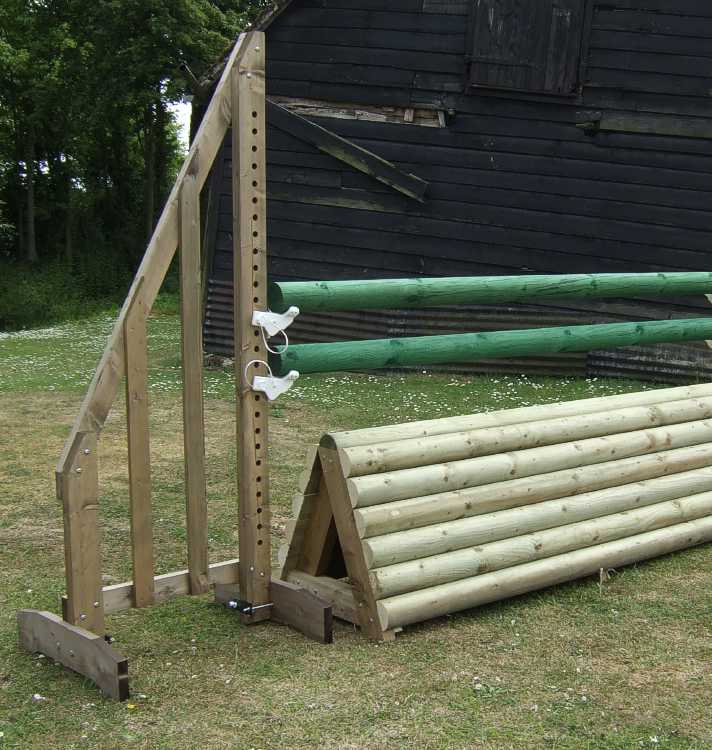 A complete working hunter jump with a classic log pile filler