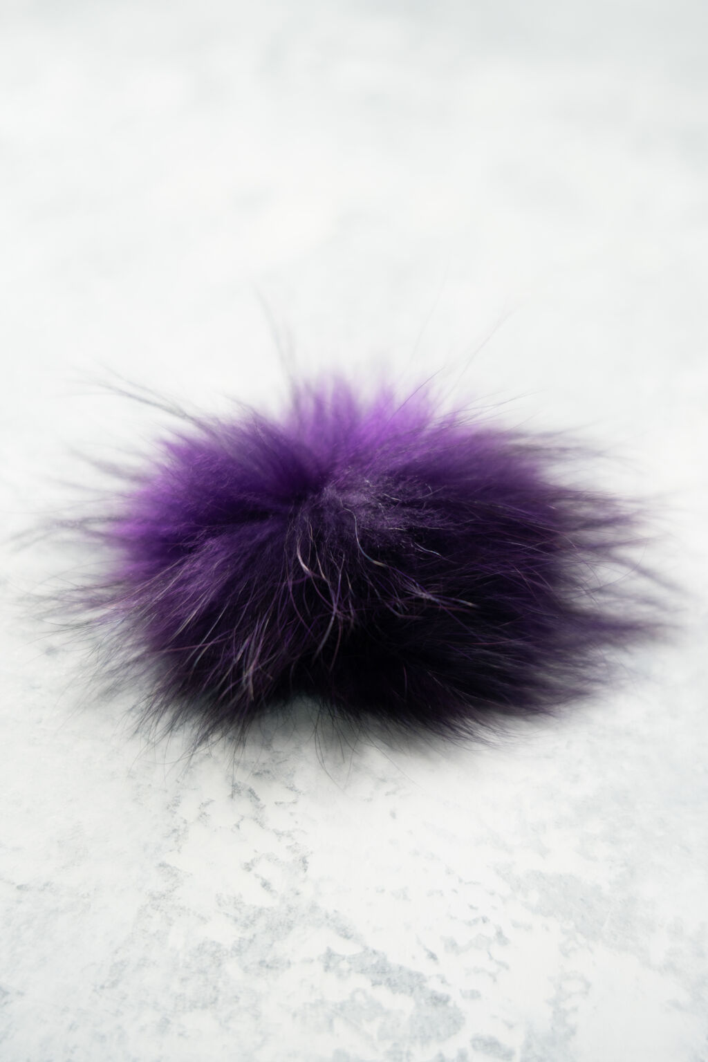 Purple fur pom